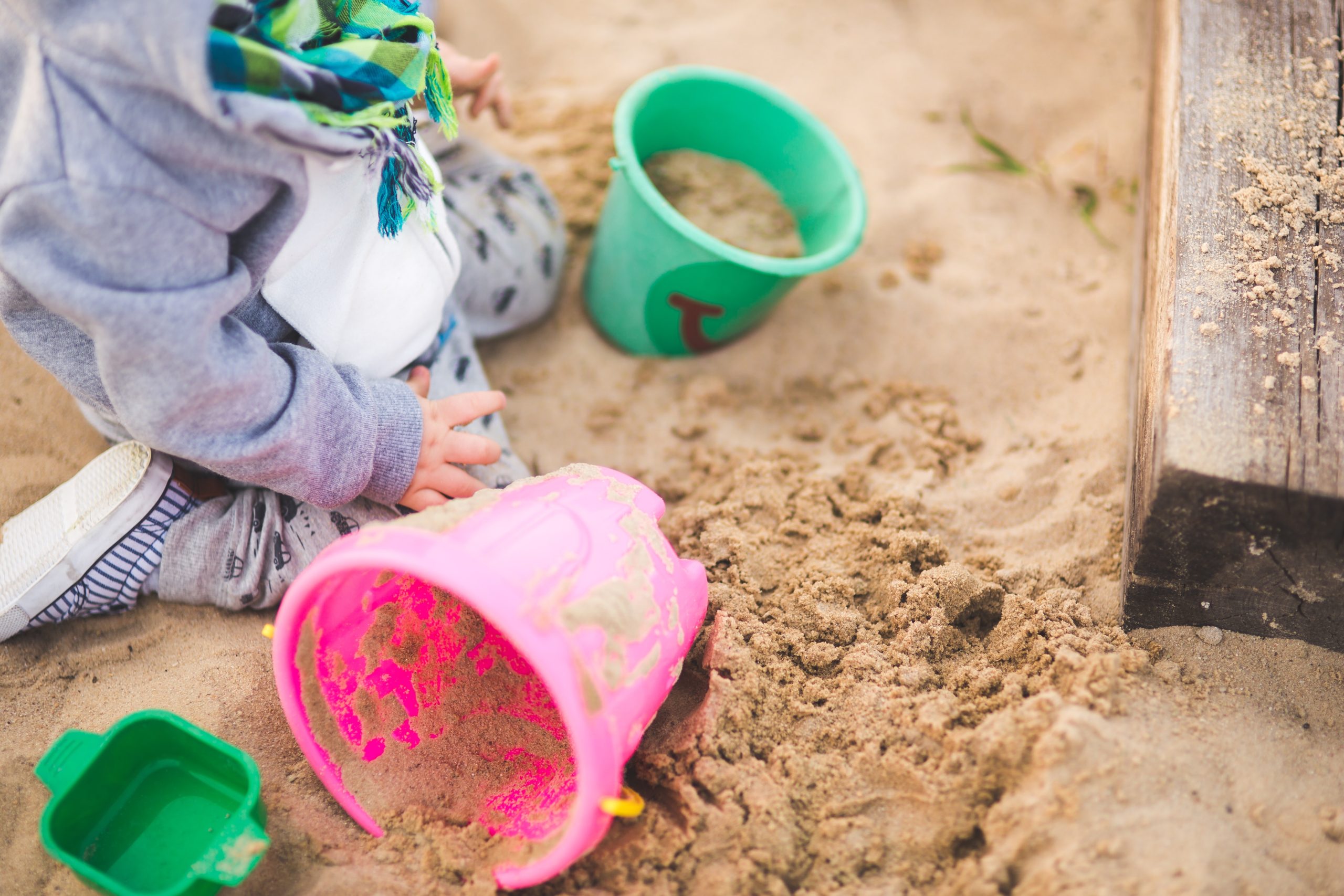 Child playing in sand generic