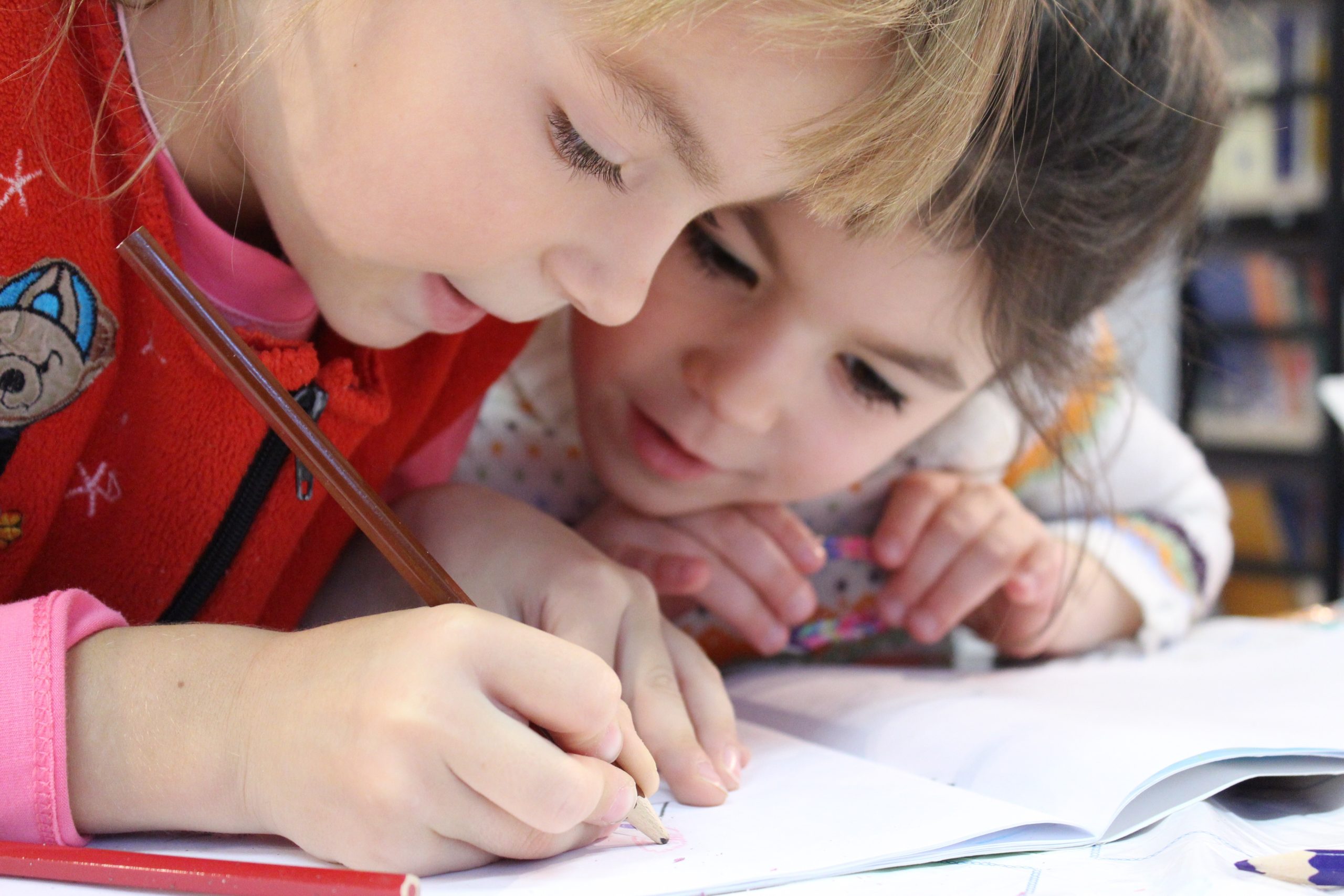 Children collaborating while working on an exercise generic